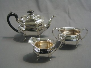 An oval silver plated 3 piece tea service comprising teapot, twin handled sugar bowl and cream jug