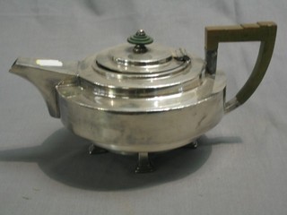 An Art Deco circular silver plated tea pot