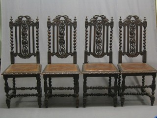 A set of 4 Victorian carved oak Carolean style high back dining chairs with pierced backs, seats upholstered in leather, raised on turned supports (frames slightly loose and 1 finial damaged)