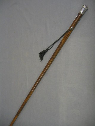 A Victorian walking cane with silver and agate finial