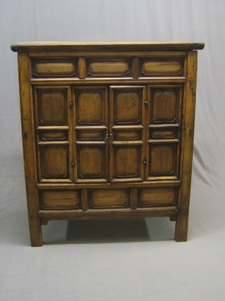 An Eastern cabinet enclosed by panelled doors 42"