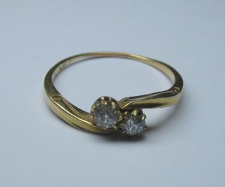 A gold dress ring set 2 white stones