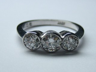 A lady's 18ct white gold engagement/dress ring set 3 circular cut diamonds (approx 1.05ct)