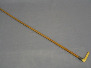 A lady's walking cane with carved stag horn handle