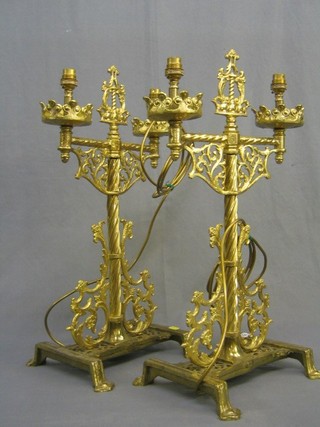 A handsome pair of Gothic style twin light brass table lamps 24"