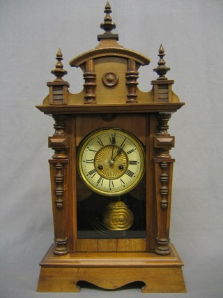 An American 8 day striking shelf clock contained in a walnut case
