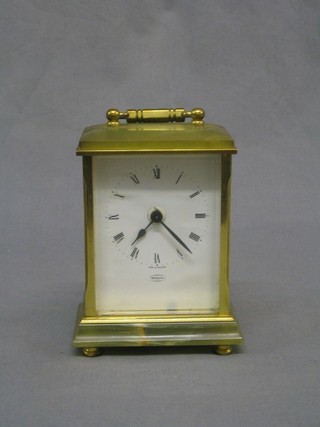 A reproduction onyx and gilt metal carriage clock with battery operated movement