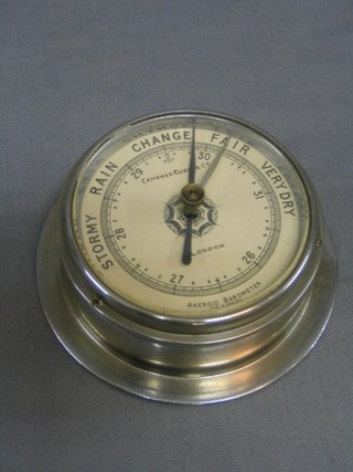 An aneroid barometer with paper dial by Camerer Cuss & Co London 4"
