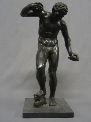 A handsome 19th Century bronze figure of a standing faun with bellows and symbols, raised on a square marble base 23"