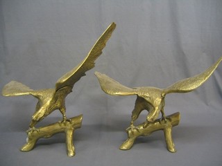A pair of modern brass figures of eagles with wings outstretched 26"