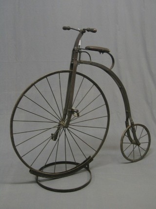 An iron model of a Penny Farthing bicycle 41" complete with stand
