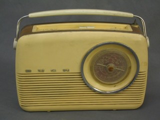A Bush type VRT 103 portable radio contained in a yellow plastic case