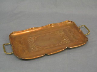 An Art Nouveau embossed copper twin handled tray 14"