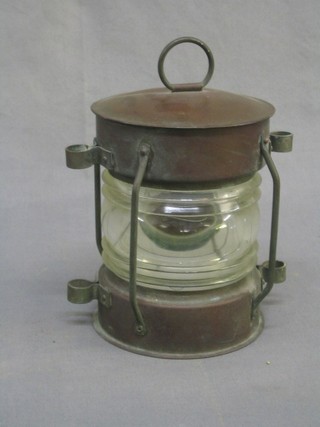 A circular copper mast head lantern, marked Simpson Lawrence 7", base missing,