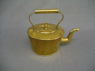 A circular brass kettle