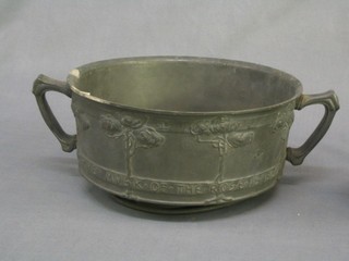 A circular Art Nouveau Tudric circular pewter bowl with stylised floral decoration, the edge marked The Woodbine Spices are Wafted Abroad and the Musk of the Rose is Blown, (base bent and some corrosion), base marked Tudric 110,  10" 