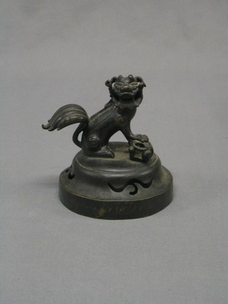 An Oriental pierced bronze Koro cover, the finial decorated a seated Dog of Fo 5"