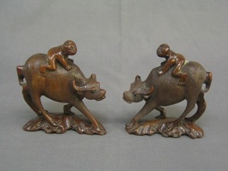 A pair of 19th Century Oriental figures of standing Water Buffalo 5" (horns f), base with signature mark