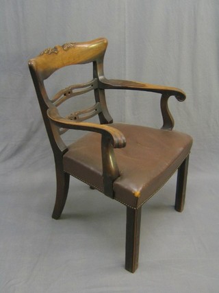 A 19th Century mahogany London ladderback desk chair with upholstered seat, raised on square supports
