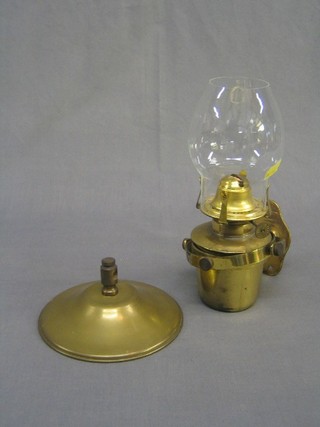 A reproduction brass gimbled ships oil lamp