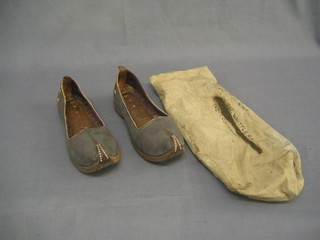 A pair of leather Turkish slippers together with original bag of transit