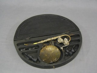 A pair of Eastern opium scales contained in a crescent shaped hardwood box decorated poppies 13" together with an Eastern metal opium pipe 