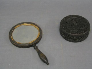 A Victorian magnifying hand mirror and a circular pierced Eastern urn cover 5"