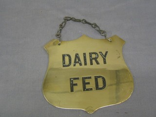 A 19th Century brass shield shaped butcher's Dead Stock sign, marked Dairy Fed, 7 1/2"