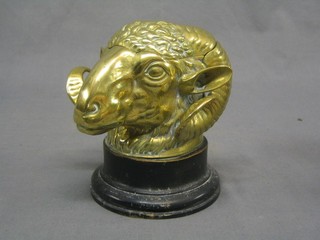 A handsome Victorian brass ink well in the form of a rams head raised on a brass socle base 4"