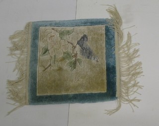 An attractive Chinese silk panel decorated a seated bird 13" x 12