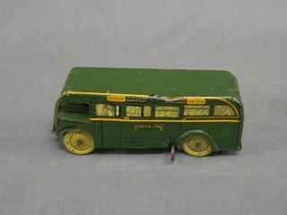 A clockwork model of a Green Line single decker coach, registration number GLX-553, body marked Glasgow, Derby, Stanmorr,  Yeovil, Cardiff, Tooting, Leeds, Sutton and Exeter (dent to lid)