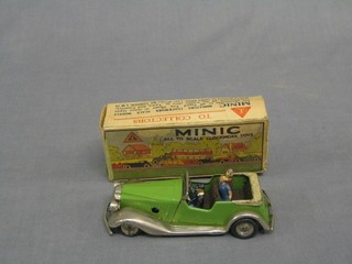 A Triang Minic clockwork model of a Morris Tourer with 4 associated figures (wheels perished), boxed