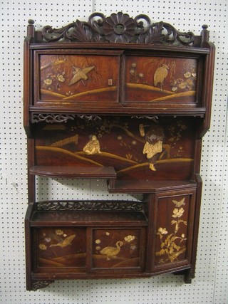 A Fujiama style hanging cabinet fitted various cupboards enclosed by panels inlaid with ivory 25"