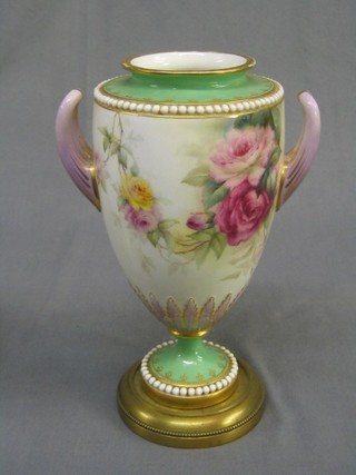 A Royal Worcester porcelain twin handled urn with green and gilt banding, floral decoration, the base with black Worcester mark, 12 dots, RD no. 369526 2148, 9", (base f)