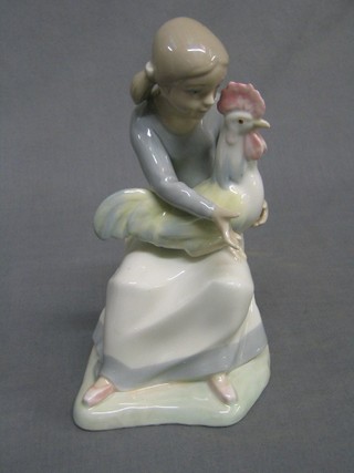 A Zaphir figure of a seated girl with cockerel 9"