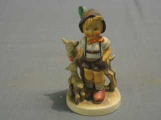 A Hummel figure of a standing boy with goat 5"
