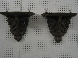A pair of Victorian pierced and carved oak brackets 11"