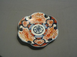 A 19th Century circular Japanese Imari porcelain dish with lobed panelled decoration 8"