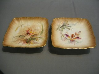 A pair of Doulton Burslem square dishes with floral decoration, raised on 4 scroll feet, base marked Burslem RD 70067, 8"