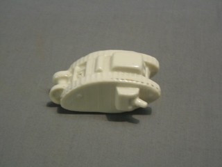 A crested china model of WWI tank decorated Arms of Aldershot
