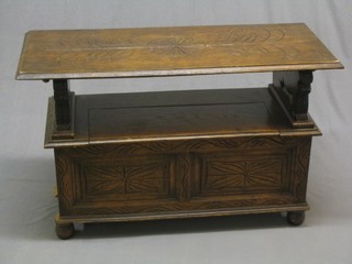A carved honey oak monks bench with hinged lid 42" (back foot missing) 