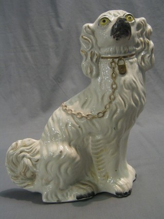 A white glazed Staffordshire figure of a seated Spaniel 13"