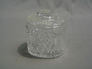 An oval cut glass biscuit barrel and cover 6"