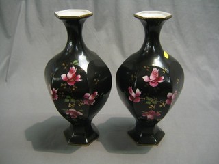 A pair of Edwardian black glazed pottery vases decorated roses 14"