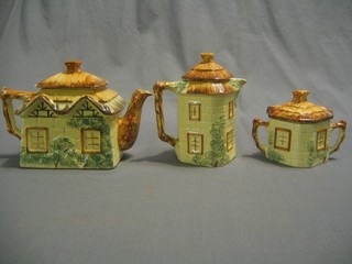 A Cottageware tea service comprising teapot, hotwater jug and cream jug (teapot lid chipped)