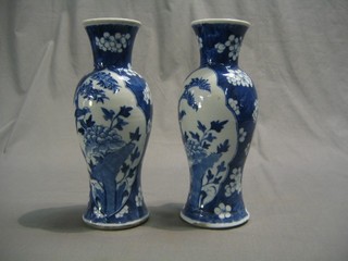 A pair of 19th Century Oriental blue and white club shaped vases, the base with 4 character mark 10"