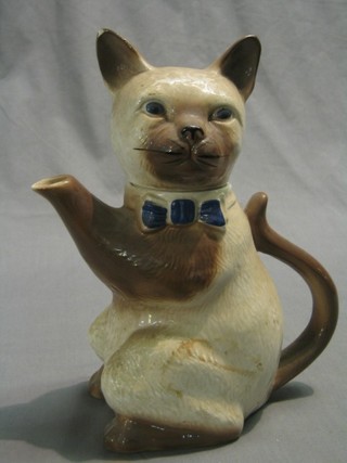 A Tony Wood pottery teapot in the form of a cat 10"