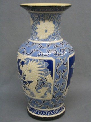 A 20th Century Oriental club shaped blue and white pottery vase 21"