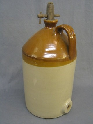 A large stoneware flagon with wooden spicket