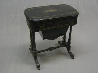 A Victorian ebonised games/work table with flip over top, inlaid backgammon, crib and chessboard, the base fitted a drawer above a deep basket, raised on turned supports united by an H framed stretcher, 26"